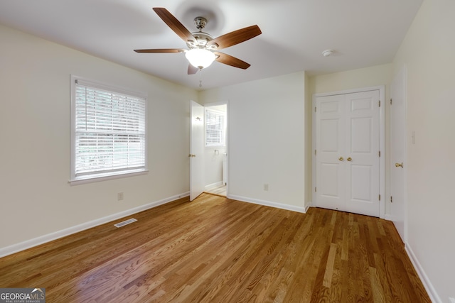 unfurnished bedroom with hardwood / wood-style flooring and ceiling fan