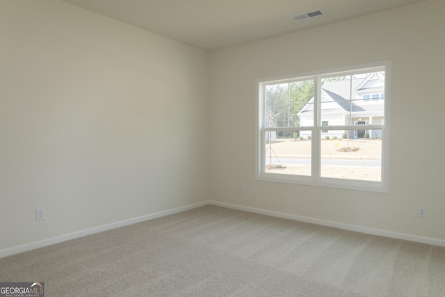 spare room featuring carpet