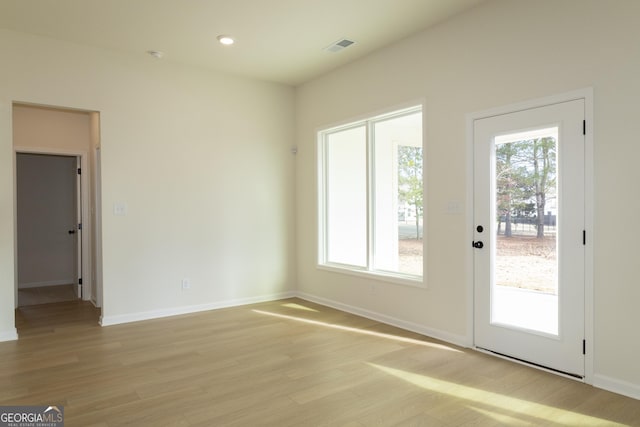 entryway with light hardwood / wood-style flooring