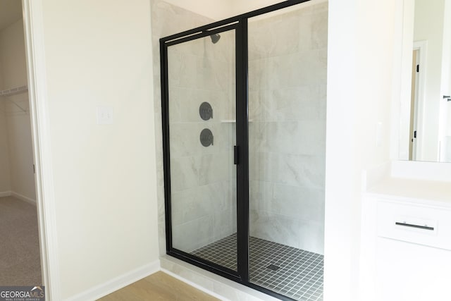 bathroom with a shower with shower door