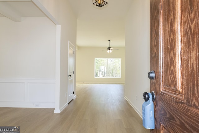 entryway with light hardwood / wood-style flooring and ceiling fan