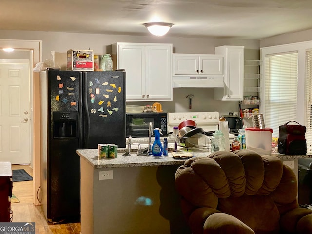 kitchen featuring white cabinets, light stone counters, light hardwood / wood-style floors, and black refrigerator with ice dispenser