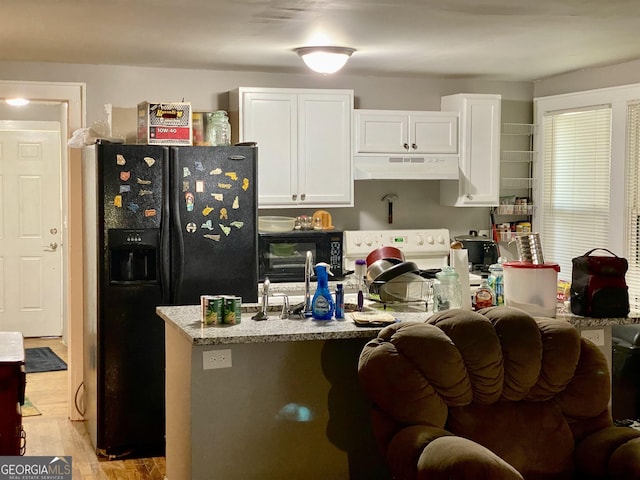 kitchen with under cabinet range hood, light wood-style floors, white cabinetry, and black fridge with ice dispenser