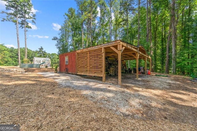 view of home's community featuring an outbuilding