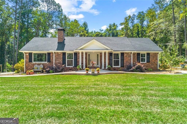 ranch-style house featuring a front lawn