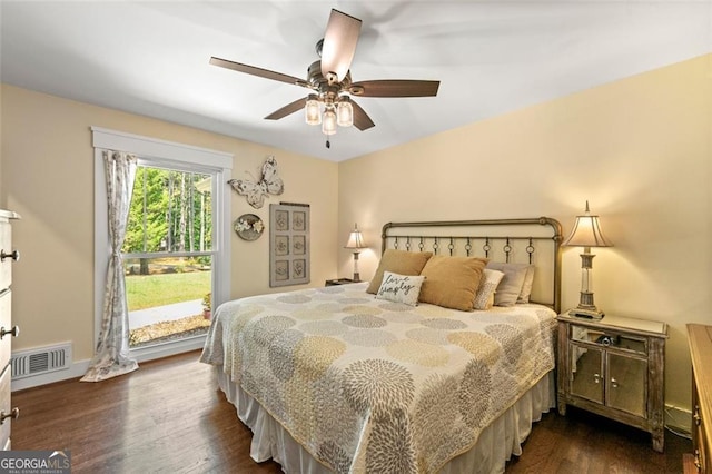 bedroom featuring dark wood-type flooring and ceiling fan