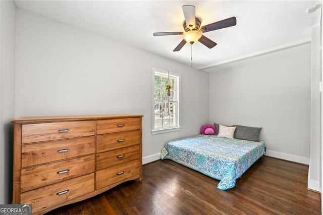 bedroom featuring ceiling fan and dark hardwood / wood-style flooring