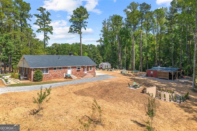 view of front of house featuring a storage shed