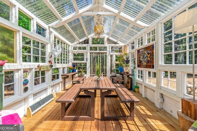 sunroom featuring lofted ceiling and plenty of natural light