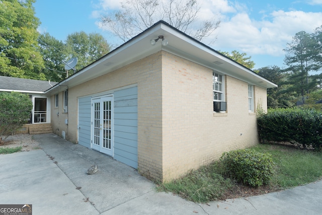 view of side of property with a patio and french doors