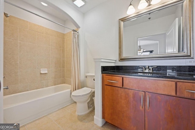 full bath featuring shower / tub combo with curtain, vanity, toilet, and tile patterned floors