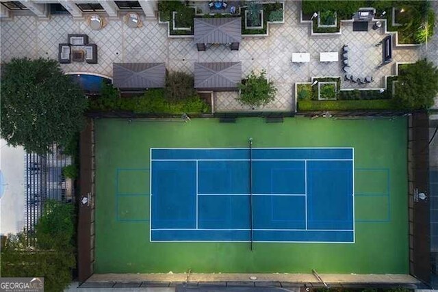 view of tennis court featuring fence