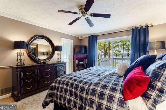 carpeted bedroom featuring a textured ceiling, crown molding, ceiling fan, and access to exterior