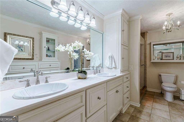 bathroom with a shower with shower door, vanity, a textured ceiling, ornamental molding, and toilet