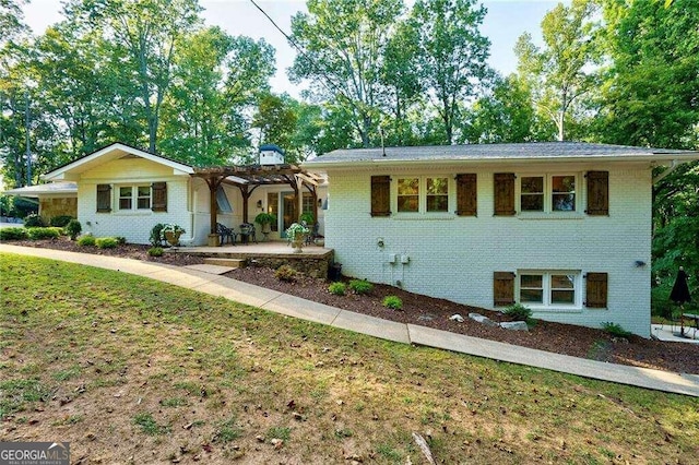 single story home featuring a patio and a front yard