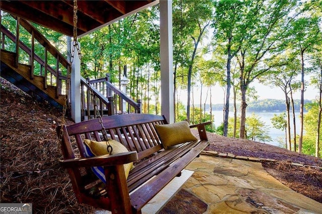 view of patio featuring a water view