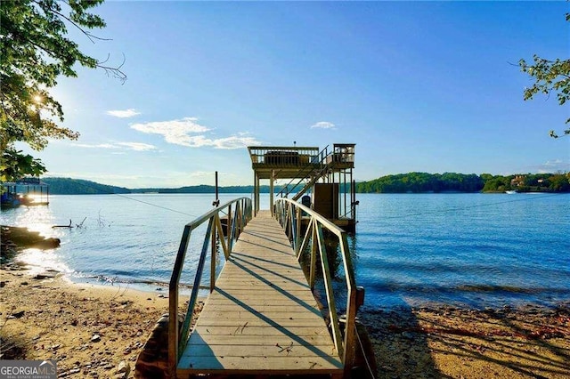 view of dock with a water view