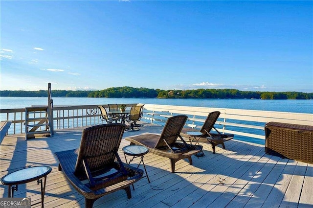 dock area with a deck with water view