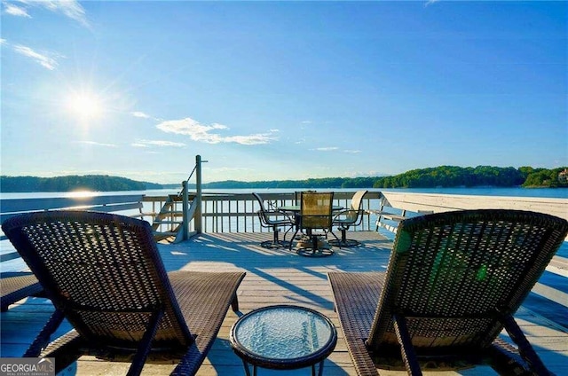 wooden deck featuring a water view