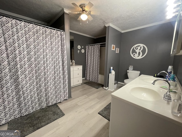 full bathroom featuring crown molding, hardwood / wood-style floors, vanity, and a textured ceiling