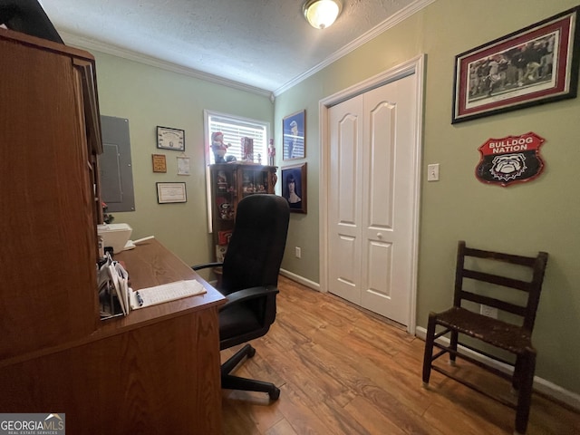 office area with ornamental molding, electric panel, and hardwood / wood-style floors