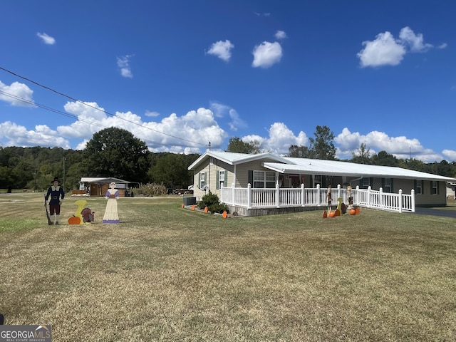 exterior space featuring a yard and covered porch