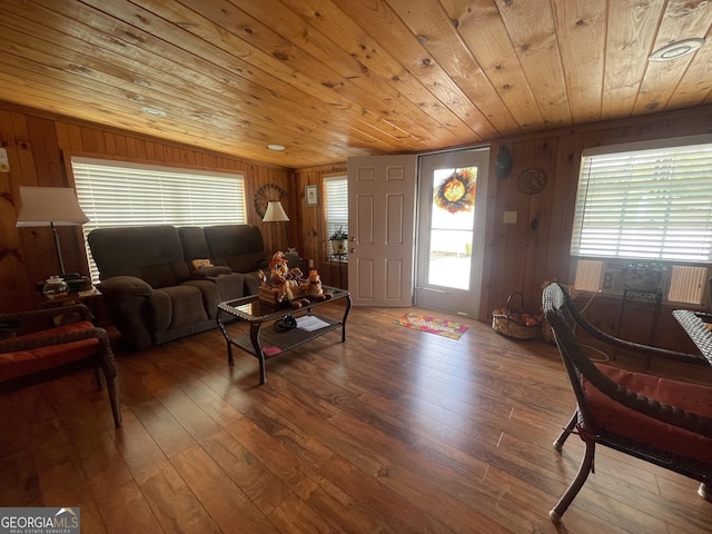 living room with hardwood / wood-style flooring, wooden ceiling, and wood walls