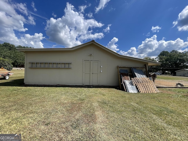 view of home's exterior with a yard