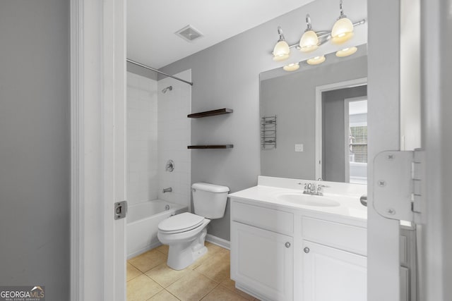 full bathroom featuring tiled shower / bath, tile patterned floors, toilet, and vanity