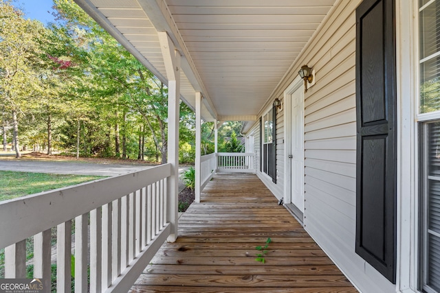 wooden deck featuring covered porch