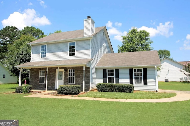 front of property featuring a porch and a front lawn