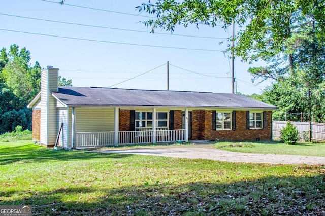 single story home with a front lawn and a porch