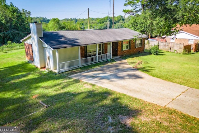 view of front of property with a front yard and covered porch