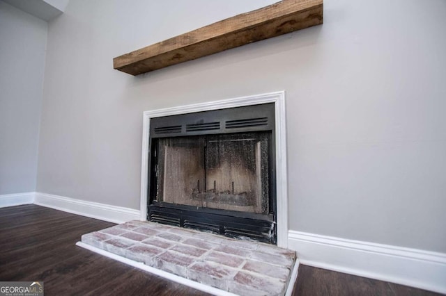 interior details featuring beamed ceiling and hardwood / wood-style flooring