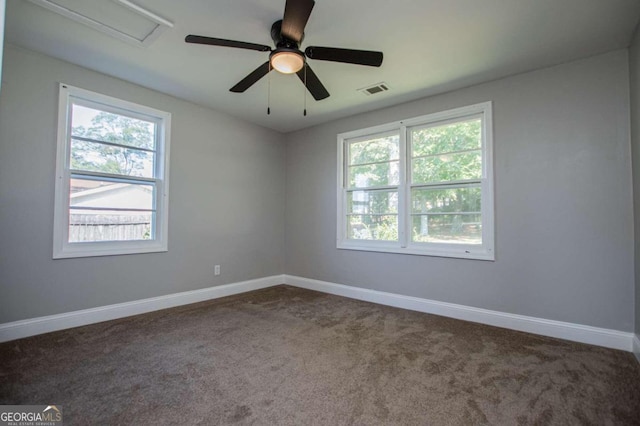 carpeted spare room featuring ceiling fan