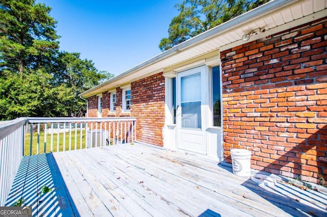 wooden deck with central AC unit