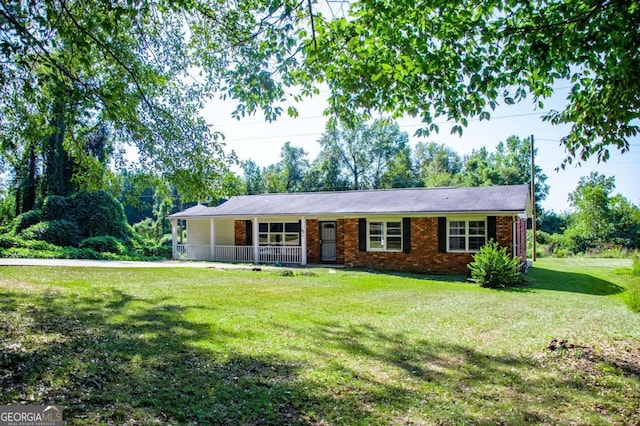 single story home featuring a front yard and covered porch