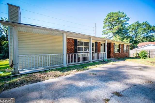 single story home featuring a porch