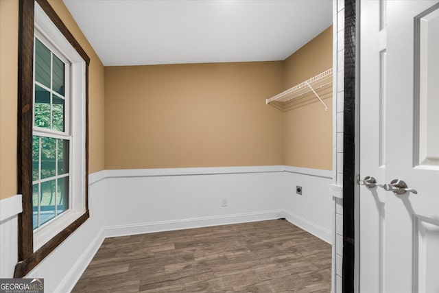 interior space with hardwood / wood-style floors and hookup for an electric dryer