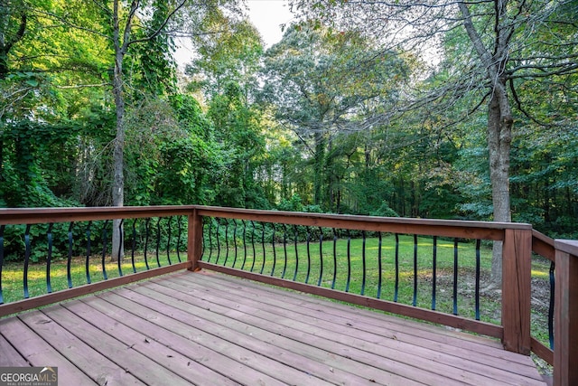 deck featuring a lawn