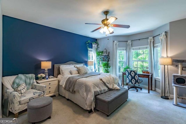 carpeted bedroom featuring ceiling fan