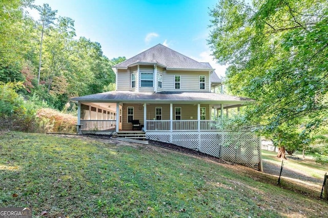 farmhouse inspired home featuring a front yard and covered porch