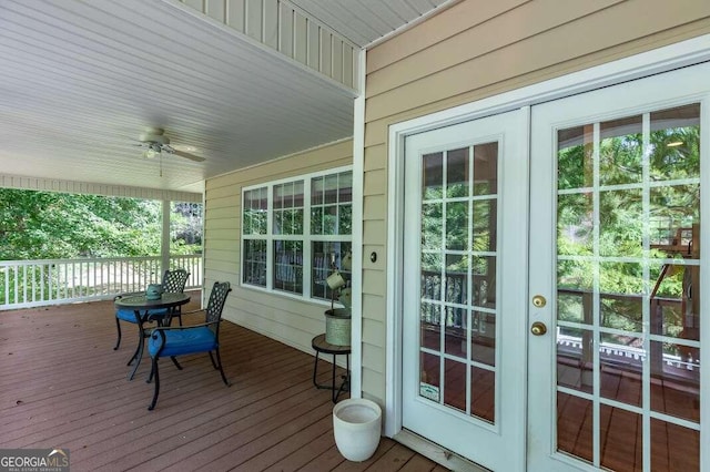 wooden terrace with ceiling fan and french doors