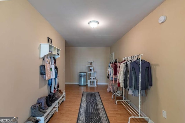 spacious closet featuring hardwood / wood-style floors