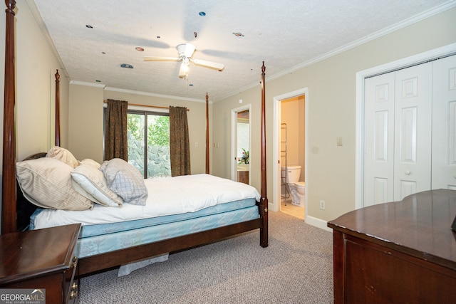 carpeted bedroom with a closet, a textured ceiling, ensuite bathroom, ornamental molding, and ceiling fan