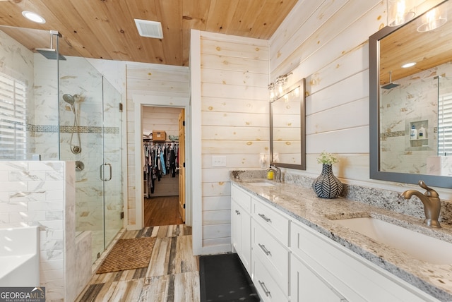 bathroom featuring vanity, walk in shower, wooden ceiling, wooden walls, and hardwood / wood-style floors