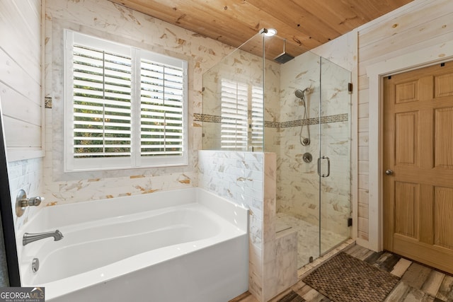 bathroom with shower with separate bathtub, hardwood / wood-style flooring, and wooden ceiling