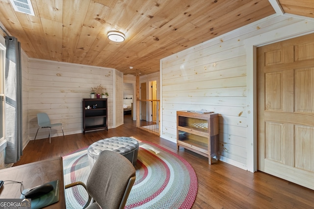 living room with wood ceiling, wood walls, and hardwood / wood-style floors