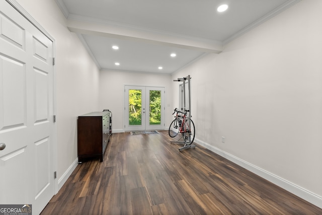 interior space featuring french doors, dark wood-type flooring, and crown molding