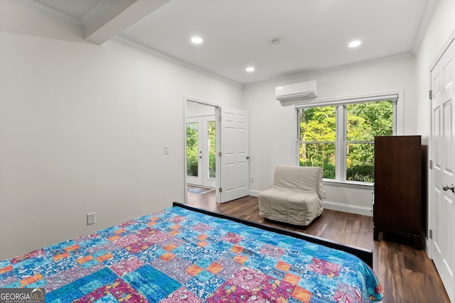 bedroom featuring beamed ceiling, ornamental molding, dark wood-type flooring, and a wall mounted AC